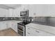Close up on a kitchen featuring stainless steel appliances and marble counters at 1319 Richfield Oaks Dr, Fuquay Varina, NC 27526