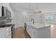 Bright kitchen with island, stainless appliances, and open layout at 1319 Richfield Oaks Dr, Fuquay Varina, NC 27526