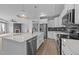 Bright kitchen with island, stainless appliances, and open layout at 1319 Richfield Oaks Dr, Fuquay Varina, NC 27526