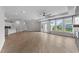 Expansive living area with multiple windows, patio access, and an open floor plan with view to the kitchen at 1319 Richfield Oaks Dr, Fuquay Varina, NC 27526