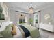 Beautiful main bedroom features coffered ceiling and an ornamental light fixture at 1319 Richfield Oaks Dr, Fuquay Varina, NC 27526