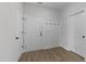 Bright mud room features wood-look flooring, a coat rack and access to the garage at 1319 Richfield Oaks Dr, Fuquay Varina, NC 27526