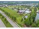 Stunning aerial view of community amenities, including a pool, clubhouse, and green space at 140 Big Barn Dr, Wendell, NC 27591