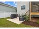 Outdoor patio area with a bench and a grill, ideal for entertaining at 140 Big Barn Dr, Wendell, NC 27591