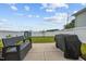 Grassy backyard featuring a seating area and a grill, enclosed by a privacy fence at 140 Big Barn Dr, Wendell, NC 27591