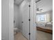 View of a toilet room with a bedrrom in the background at 140 Big Barn Dr, Wendell, NC 27591