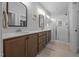 Spacious bathroom with double vanity, tile floors, and a glass-enclosed shower at 140 Big Barn Dr, Wendell, NC 27591
