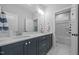 Bright bathroom with double sinks, a large mirror, and stylish vanity at 140 Big Barn Dr, Wendell, NC 27591