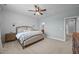 Comfortable bedroom featuring a stylish bed, paneling, and an ensuite bathroom at 140 Big Barn Dr, Wendell, NC 27591