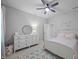 Bright bedroom featuring a dresser, carpet, and a decorative 'Harper' wall sign at 140 Big Barn Dr, Wendell, NC 27591
