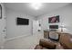 This bedroom has carpet floors, a tv, a computer desk, and a walk-in closet at 140 Big Barn Dr, Wendell, NC 27591