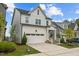 Beautiful two-story home with a well-manicured lawn and a convenient two-car garage at 140 Big Barn Dr, Wendell, NC 27591