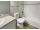 This bathroom is equipped with modern fixtures, updated flooring, and a tub with tiled walls at 1508 Hodge Rd, Knightdale, NC 27545