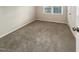 Cozy bedroom featuring neutral carpeting and a window offering natural light at 1508 Hodge Rd, Knightdale, NC 27545