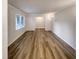 A spacious living room with new hardwood flooring and natural light from the large front window at 1508 Hodge Rd, Knightdale, NC 27545