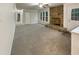 Cozy living room featuring a striking stone fireplace, neutral carpet and lots of natural light at 1508 Hodge Rd, Knightdale, NC 27545