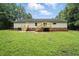 Spacious backyard with wooden decks and lush green lawn at 160 Deer Tracks Dr, Wendell, NC 27591