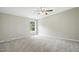 Bedroom showcasing a ceiling fan, soft carpet, natural light and a large window at 160 Deer Tracks Dr, Wendell, NC 27591