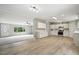 A light filled kitchen blends seamlessly into the spacious living room in this modern open concept home at 160 Deer Tracks Dr, Wendell, NC 27591