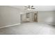 Bright, open living room with plush carpeting, soft paint, and views to the kitchen and hallway at 160 Deer Tracks Dr, Wendell, NC 27591