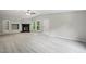 Open living room featuring fireplace, modern carpet, vaulted ceiling and built in shelving at 160 Deer Tracks Dr, Wendell, NC 27591
