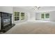 Spacious living room with vaulted ceilings, fireplace and a great view from the windows at 160 Deer Tracks Dr, Wendell, NC 27591