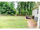 Large backyard with well-kept lawn and privacy fence offering a peaceful outdoor space at 1605 Goldsboro Ave, Sanford, NC 27330