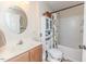 Full bathroom with modern fixtures, offering a tub and shower combination and functional cabinet at 1605 Goldsboro Ave, Sanford, NC 27330