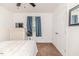 Bright bedroom with carpet, closet, and simple furnishings, providing a cozy and comfortable atmosphere at 1605 Goldsboro Ave, Sanford, NC 27330
