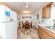 Open kitchen and dining area with access to appliances and a back door at 1605 Goldsboro Ave, Sanford, NC 27330
