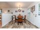 Dining area with a wooden table set, chandelier, and direct access to outdoors at 1605 Goldsboro Ave, Sanford, NC 27330