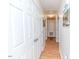 Bright hallway with hardwood flooring and multiple closets for ample storage at 1605 Goldsboro Ave, Sanford, NC 27330