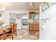 Functional kitchen area with a dining table and neutral flooring at 1605 Goldsboro Ave, Sanford, NC 27330