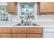 Close up on the stainless steel, double basin kitchen sink with window view at 1605 Goldsboro Ave, Sanford, NC 27330