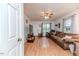 Well-lit living room with hardwood floors, neutral color scheme, and comfortable seating at 1605 Goldsboro Ave, Sanford, NC 27330