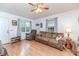 Bright living room featuring hardwood floors, cozy seating, and generous natural light at 1605 Goldsboro Ave, Sanford, NC 27330