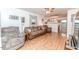 Cozy living room with hardwood floors, ceiling fan, and ample natural light at 1605 Goldsboro Ave, Sanford, NC 27330