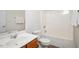 Bathroom with a single sink, toilet and bathtub with shower at 1642 Holly Grove Way, Durham, NC 27713