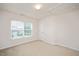 Bedroom with neutral carpet, a large window, and a closet at 1642 Holly Grove Way, Durham, NC 27713