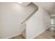 Hallway features wood-look flooring, a staircase and access to multiple rooms at 1642 Holly Grove Way, Durham, NC 27713