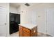 Kitchen featuring stainless steel appliances, light countertops and center island at 1642 Holly Grove Way, Durham, NC 27713