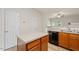 Kitchen featuring stainless steel appliances, light countertops and center island at 1642 Holly Grove Way, Durham, NC 27713