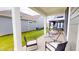 Comfortable seating and hammock under the covered patio, perfect for outdoor relaxation and entertaining at 1720 Pinecliff Ct, Fuquay Varina, NC 27526