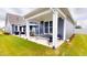 The backyard features a nice covered patio and green grass at 1720 Pinecliff Ct, Fuquay Varina, NC 27526