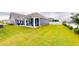 Spacious backyard featuring a well-maintained lawn, white fencing, and an outdoor patio area at 1720 Pinecliff Ct, Fuquay Varina, NC 27526