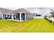 The backyard features a nice covered patio and green grass at 1720 Pinecliff Ct, Fuquay Varina, NC 27526
