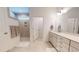 Elegant bathroom with a tiled shower, double vanity, and neutral color palette for a relaxing experience at 1720 Pinecliff Ct, Fuquay Varina, NC 27526