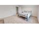 This is a clean bedroom with carpet, closet, and an open door at 1720 Pinecliff Ct, Fuquay Varina, NC 27526