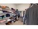 Spacious walk-in closet with ample shelving, hanging space, and organized storage for all your wardrobe needs at 1720 Pinecliff Ct, Fuquay Varina, NC 27526