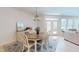 Bright dining room features a chandelier, oval table, buffet, and access to the backyard at 1720 Pinecliff Ct, Fuquay Varina, NC 27526
